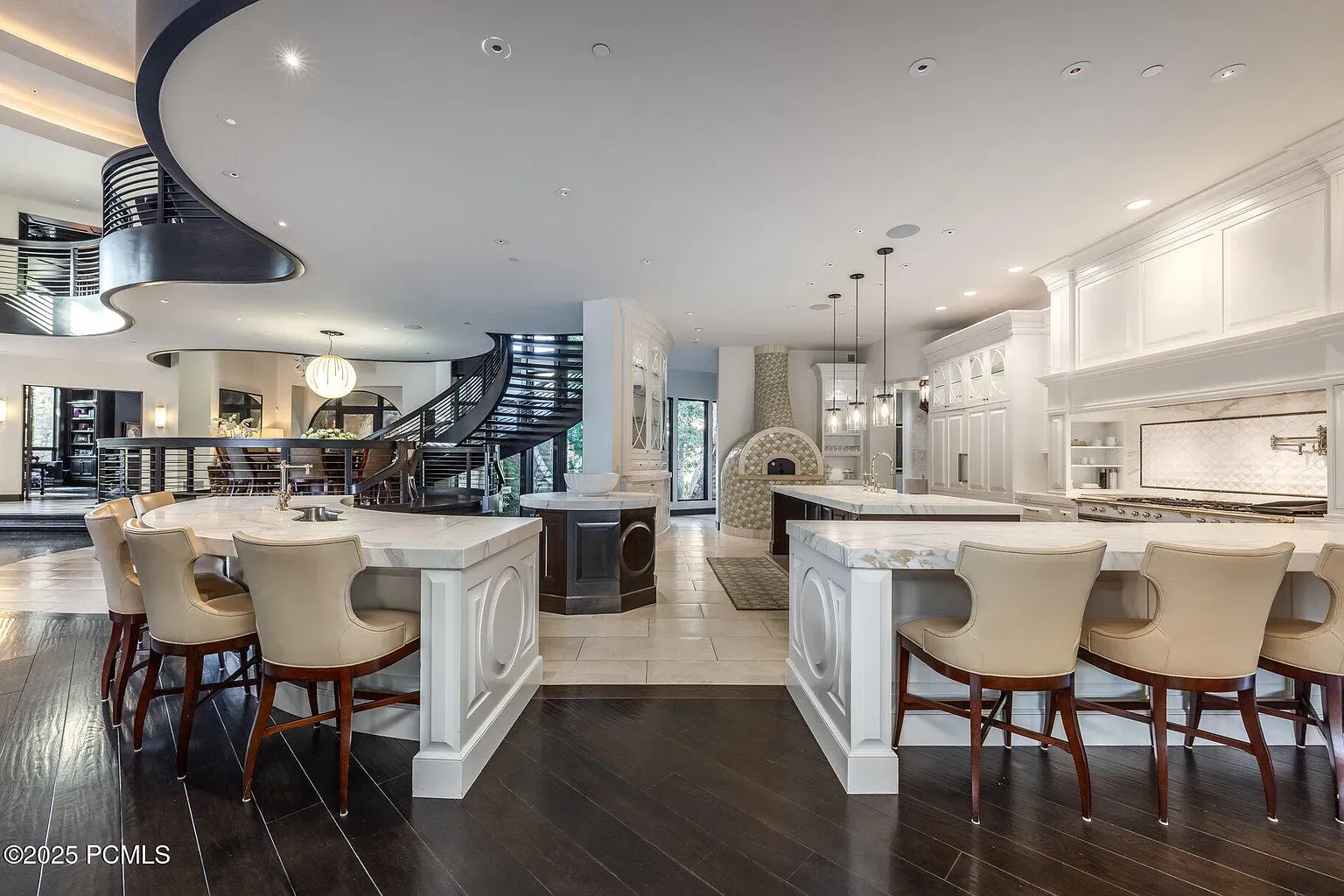 Here's the kitchen island. dark wood, white quartz. Clean lines, tons storage.