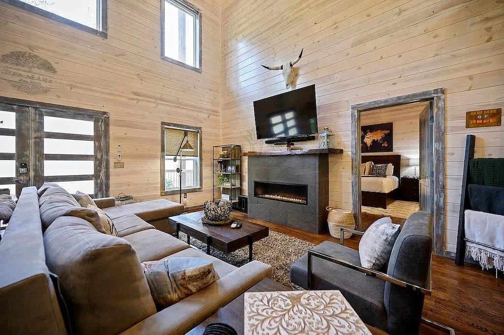 Big windows everywhere. The wood walls keep it warm, not stark.