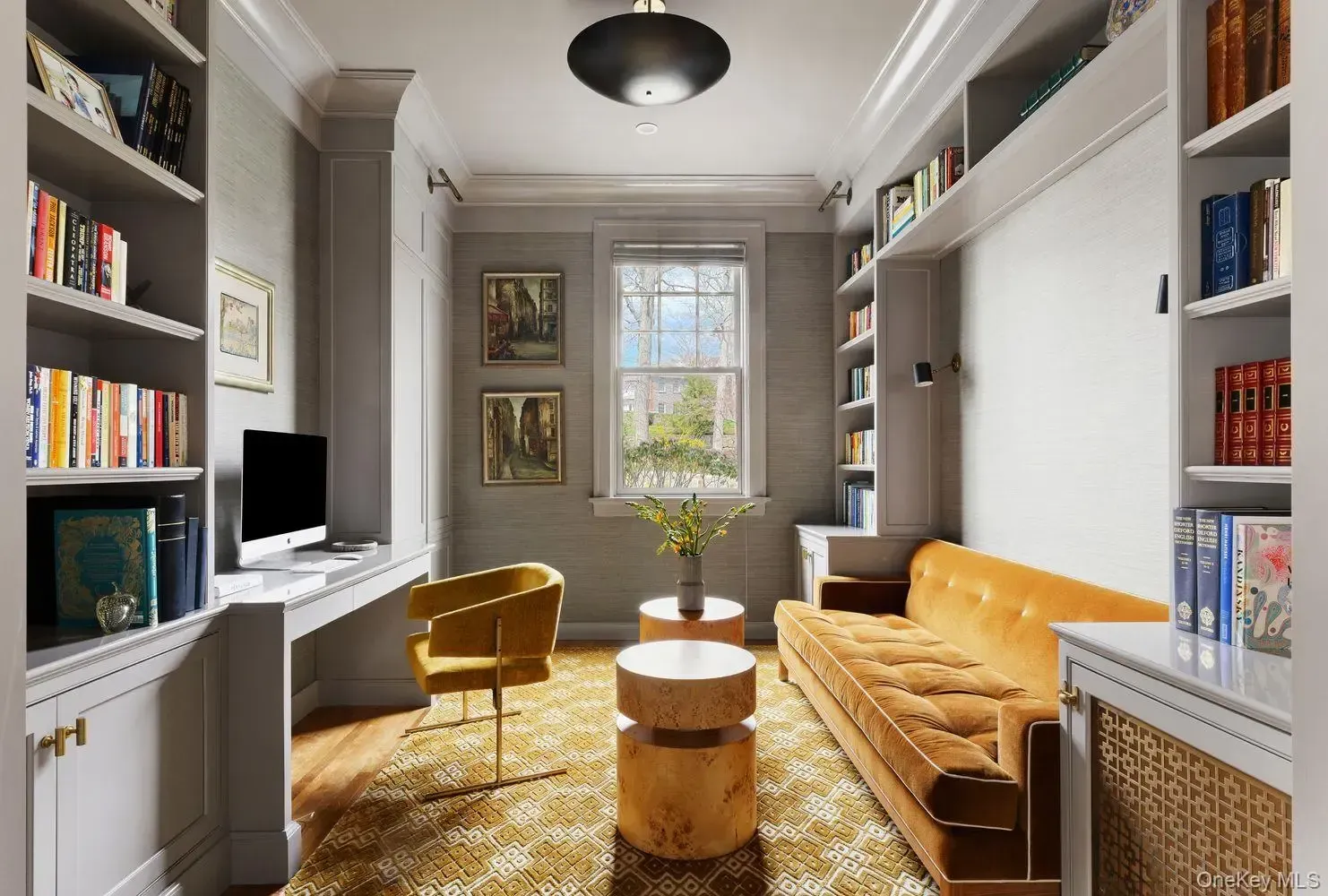 Taupe walls, warm wood, quiet little work nook. I’d actually focus here.