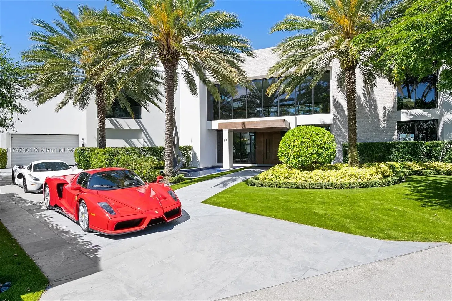 Another exterior angle. white stucco and stone, those windows are massive.