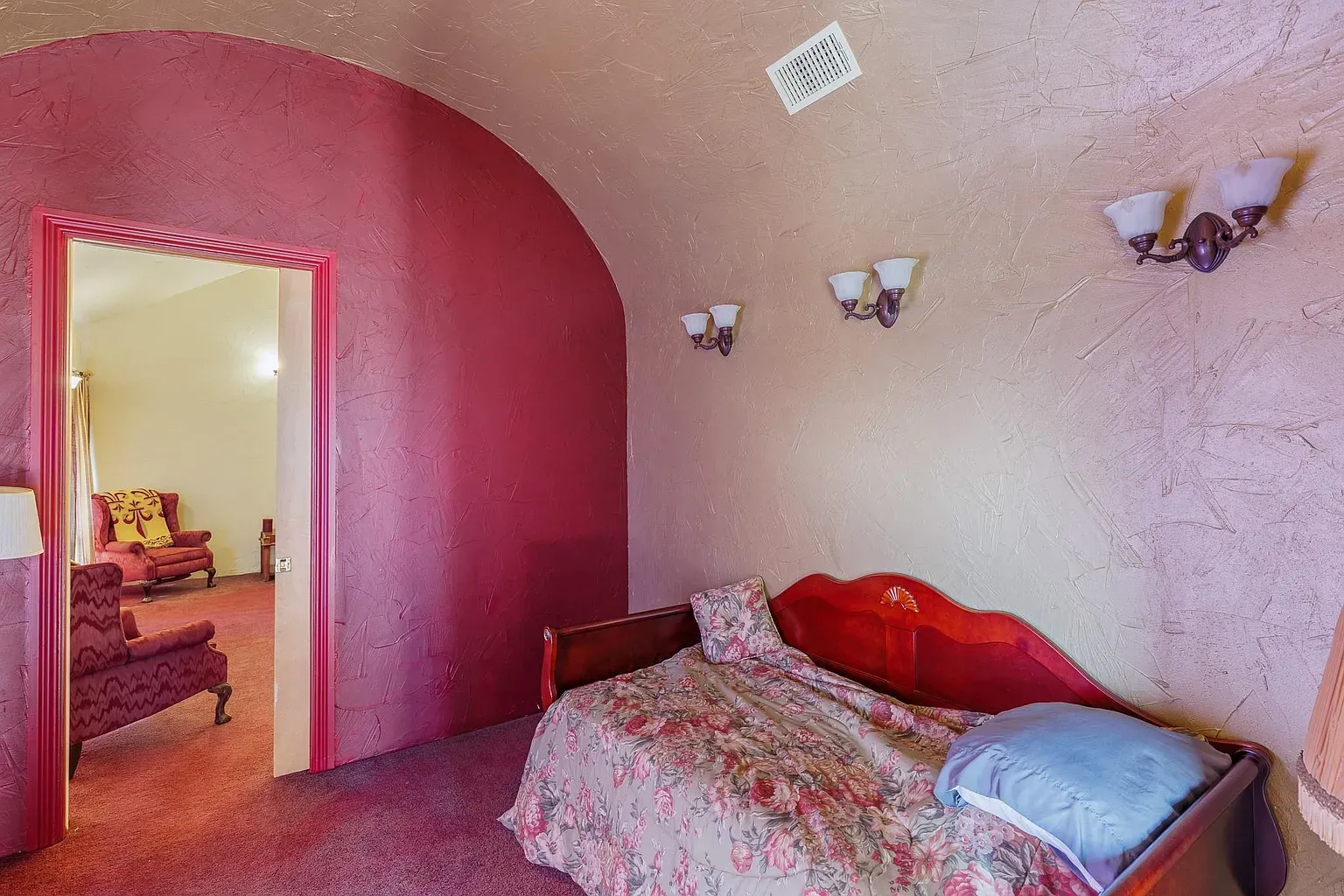 Soft pink gradients on the walls. The arch detail is surprisingly sweet.