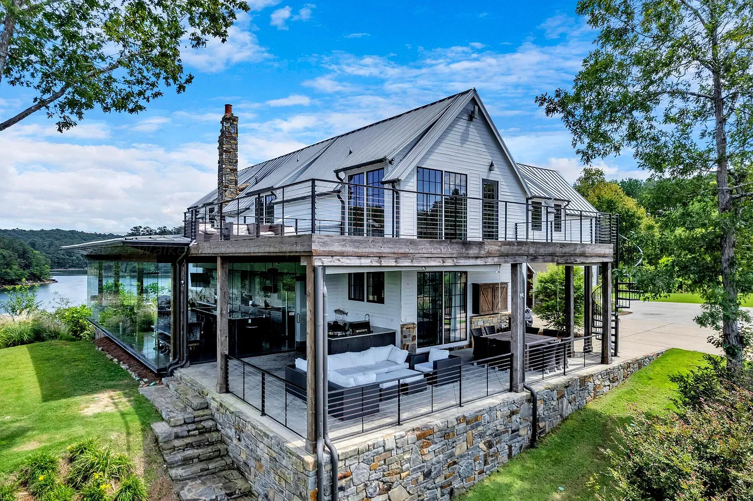 Stone and metal facade, very mountain-modern. That standing seam roof is crisp.