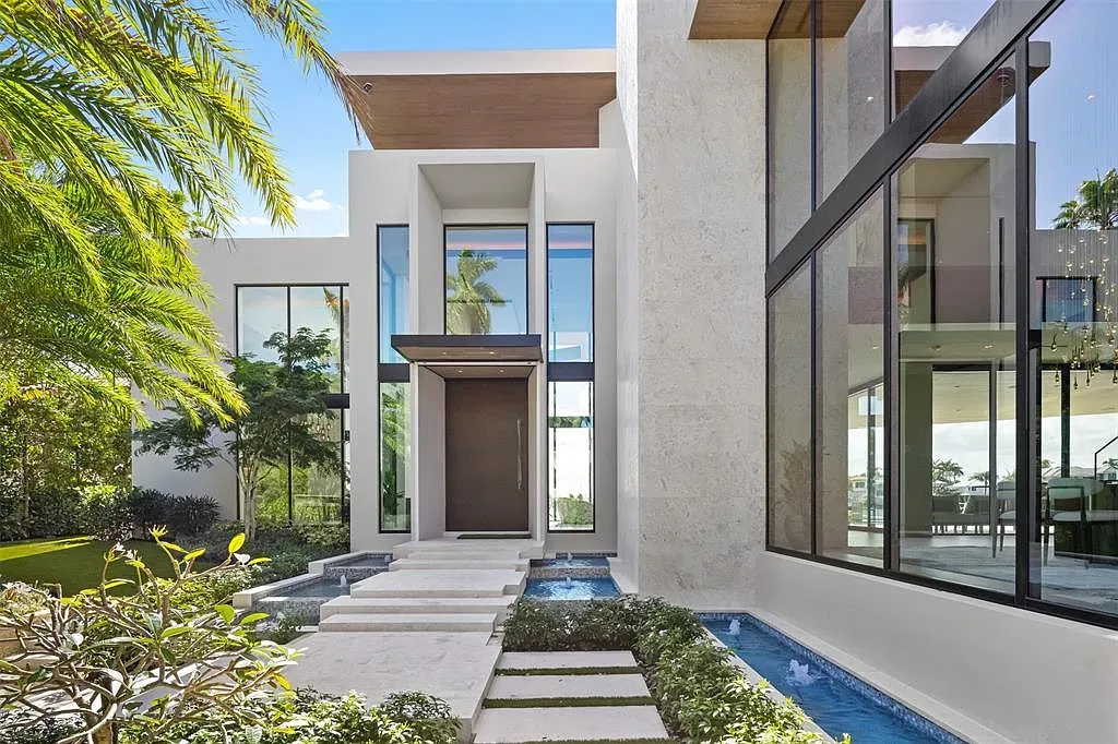 And then this facade—white stucco, light stone. Simple, sharp, no notes.