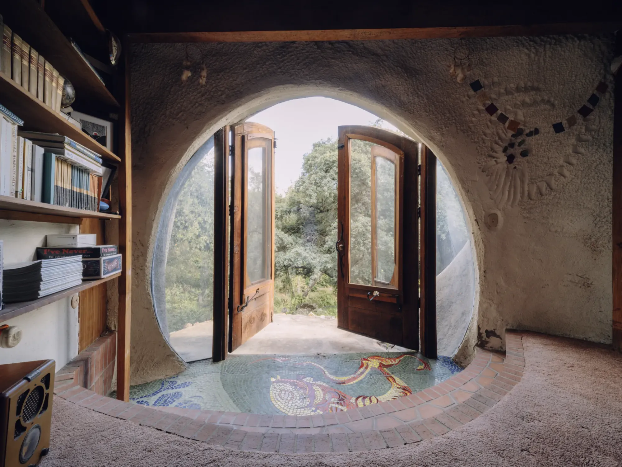 Those twin arched doors just open the whole place to the trees.