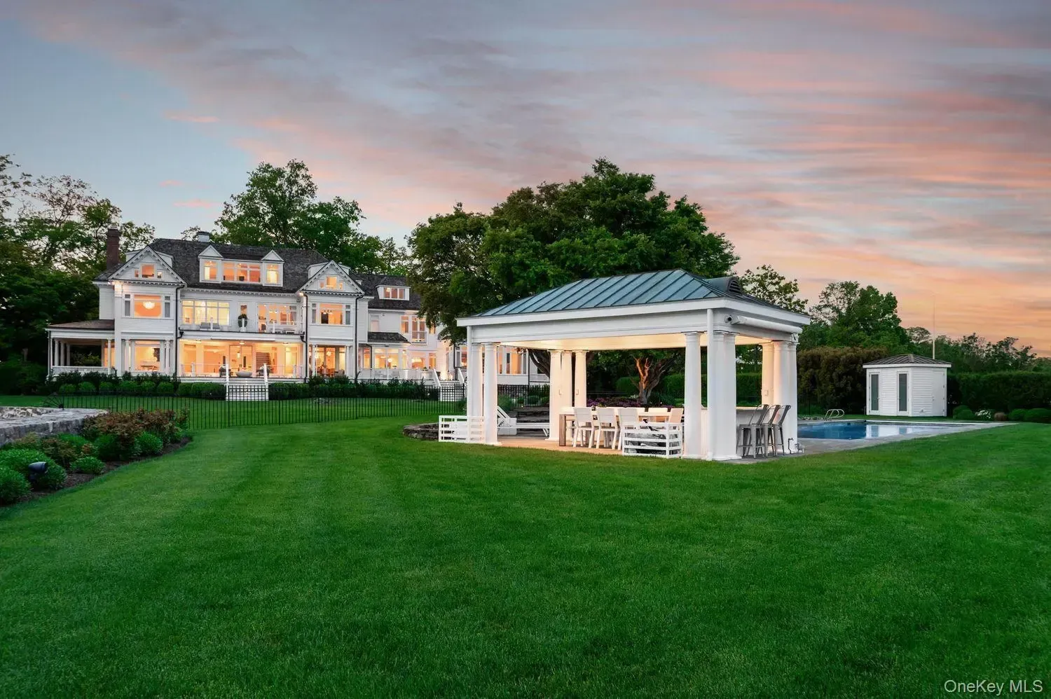 Backyard pavilion looks ready for a long dinner and a longer nap.