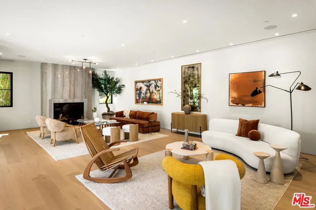 Huge living room, soft walls, tons of light. Focal wall quietly steals attention.