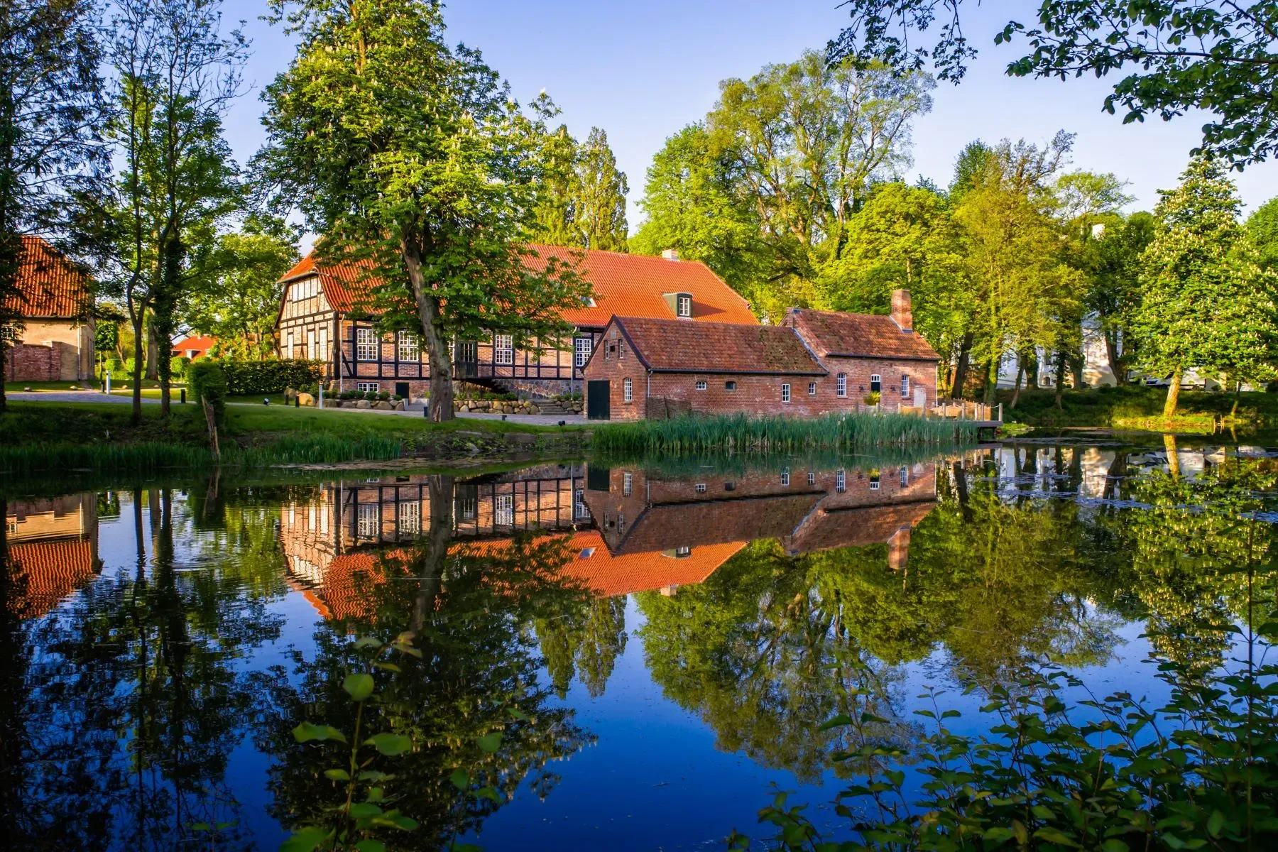 Big timber-framed farmhouse, red tiles, white stucco. Feels straight out of Europe.