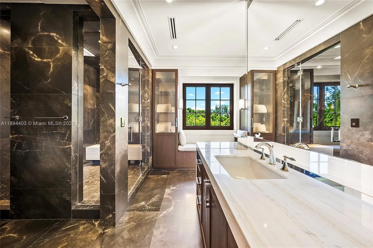Okay, this bathroom—dark veined marble everywhere. Gorgeous, maybe slippery?