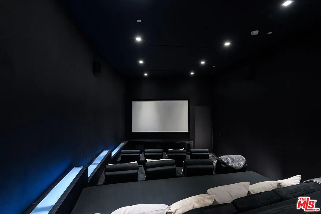 Blackout theater room. Low ceiling, big screen, bring the popcorn.