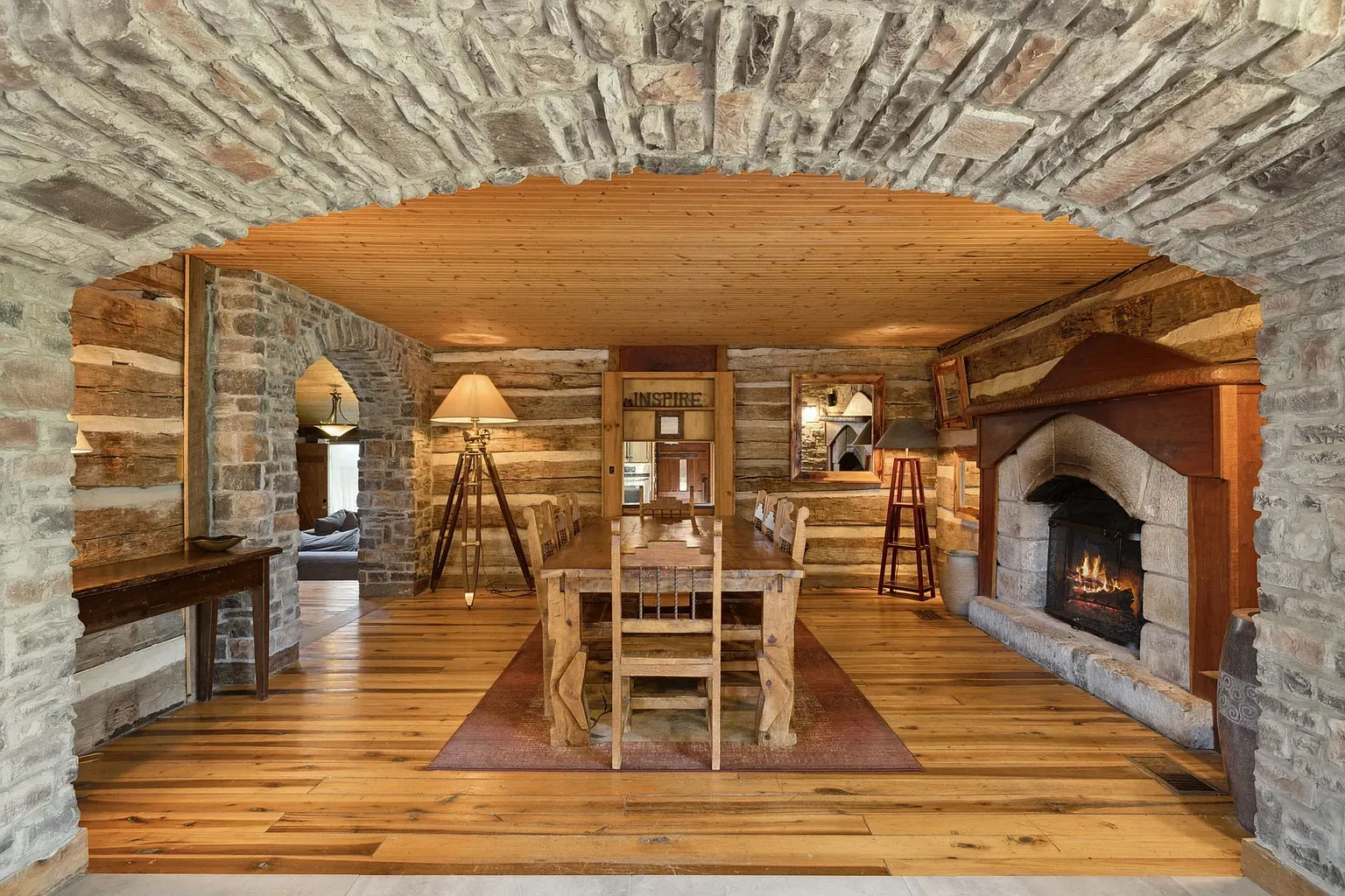 Mismatched chairs, big wood table. Zero pretense, all cozy dinner energy.