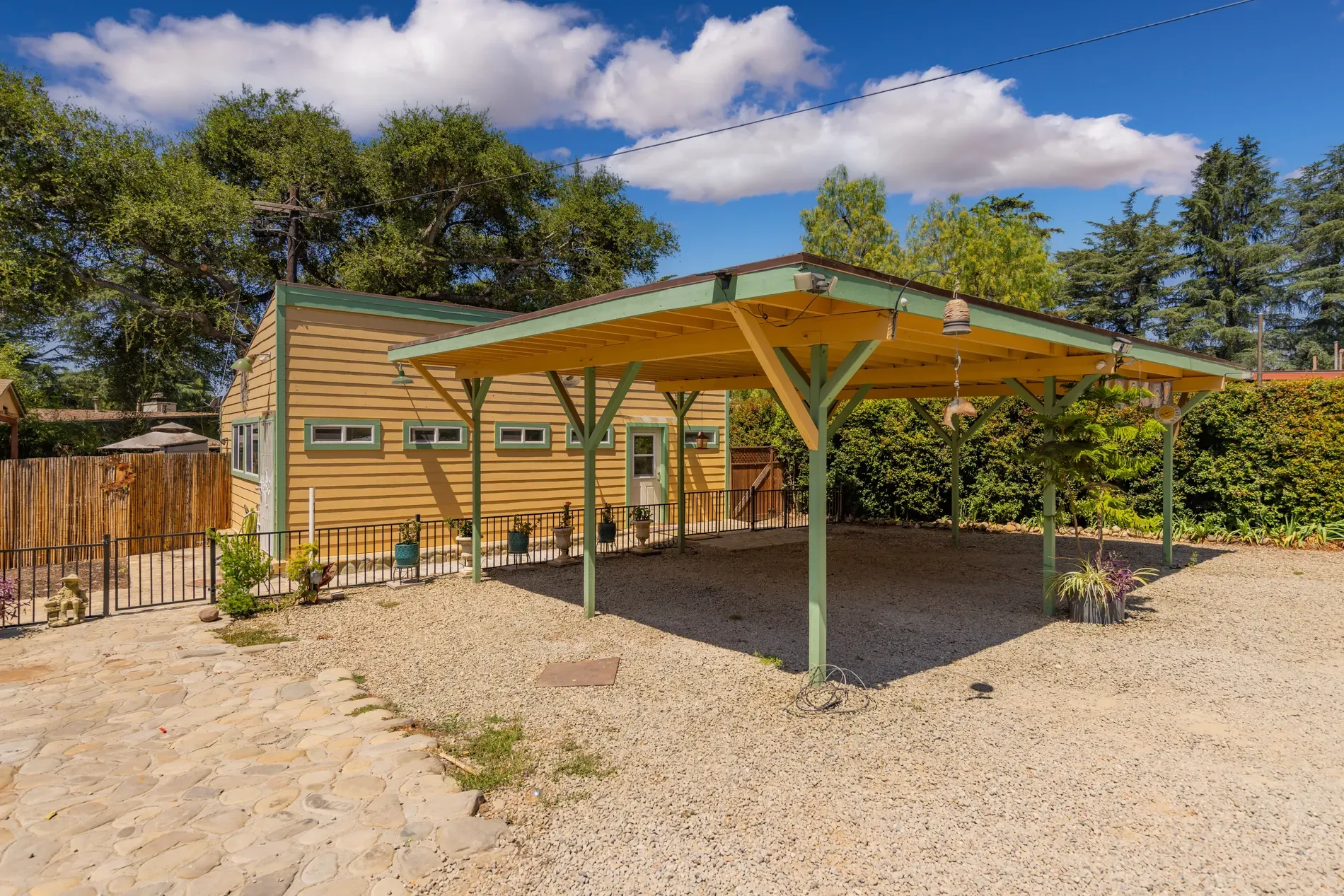 Mustard yellow exterior with green trim, modern meets rustic in a cute way.