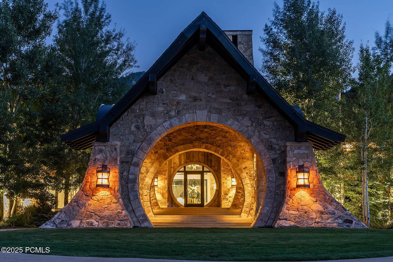 Here's the entry with stone arches and lanterns. Warm and kind of castle-y.