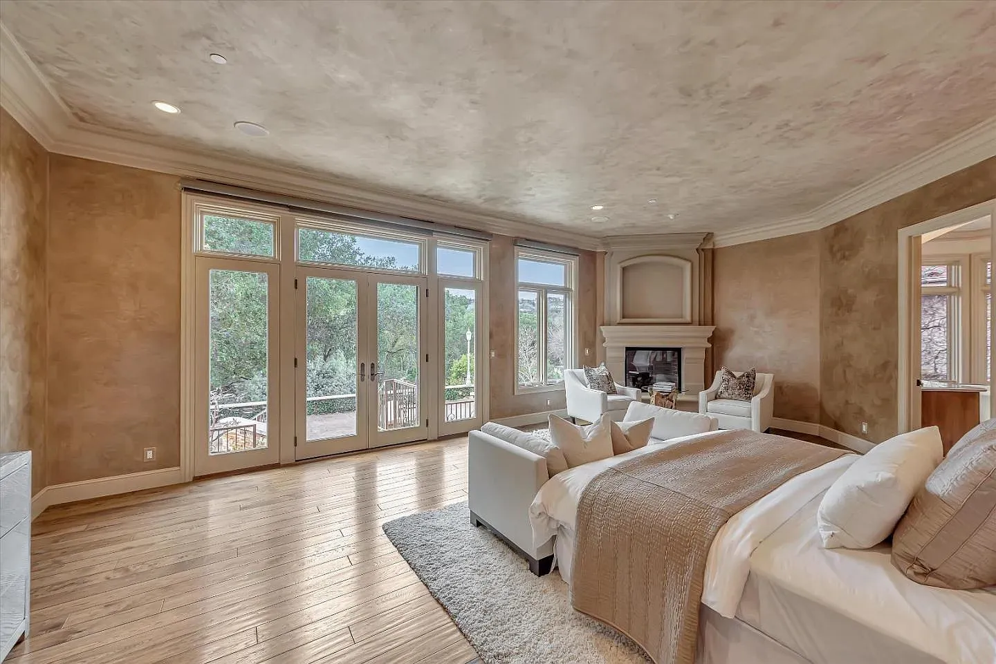 Calm bedroom palette, giant windows to the trees. Easy place to actually sleep.