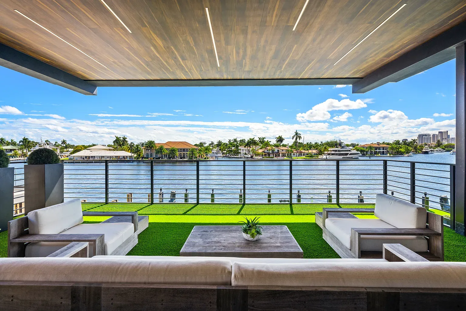 Terrace right on the water. White sofas somehow staying spotless.