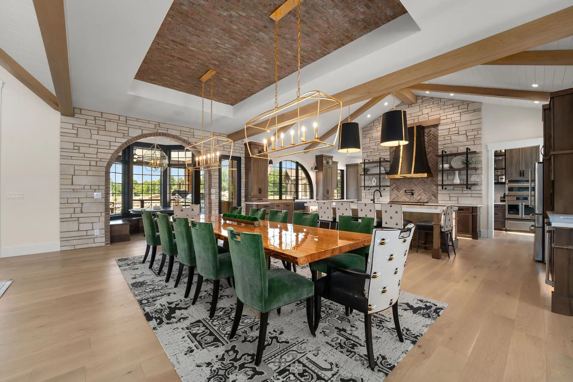 Long table for too many friends. Mixed chairs, statement lights overhead.