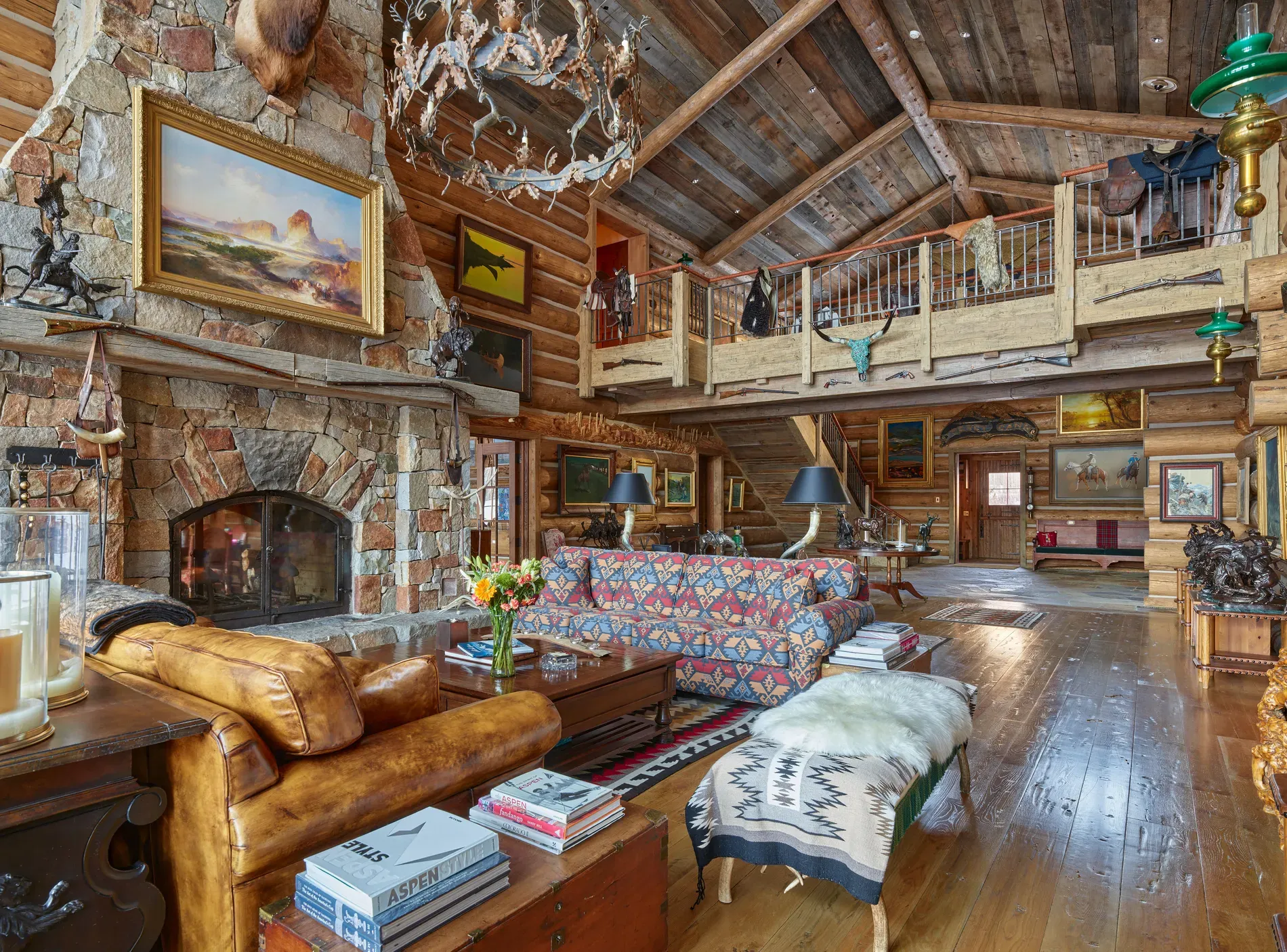 Great room finale — vaulted logs, stone walls. I mean, dramatic in good way.