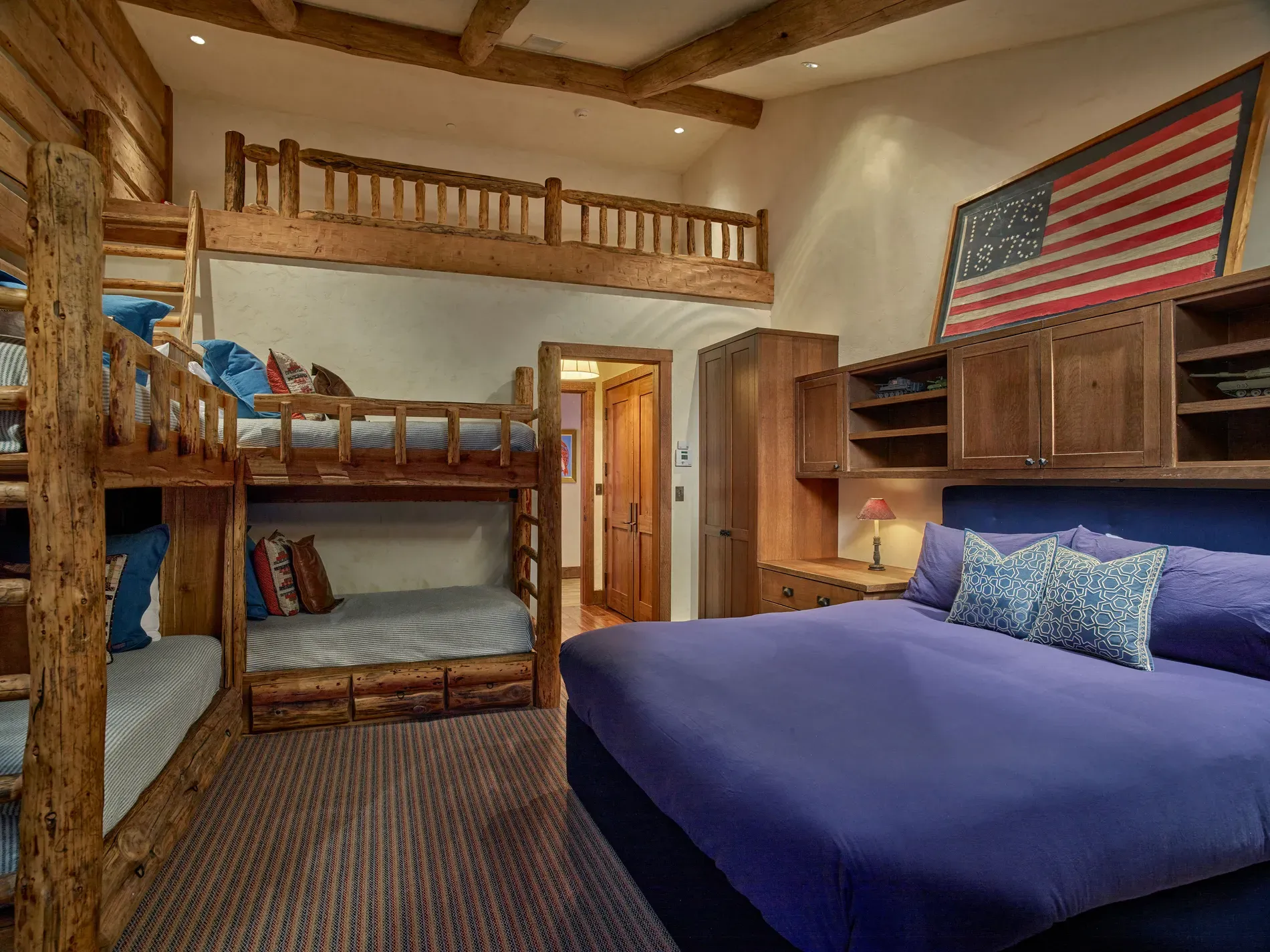 Bunk room time — chunky wood bunks, beige walls, cozy camp memories.
