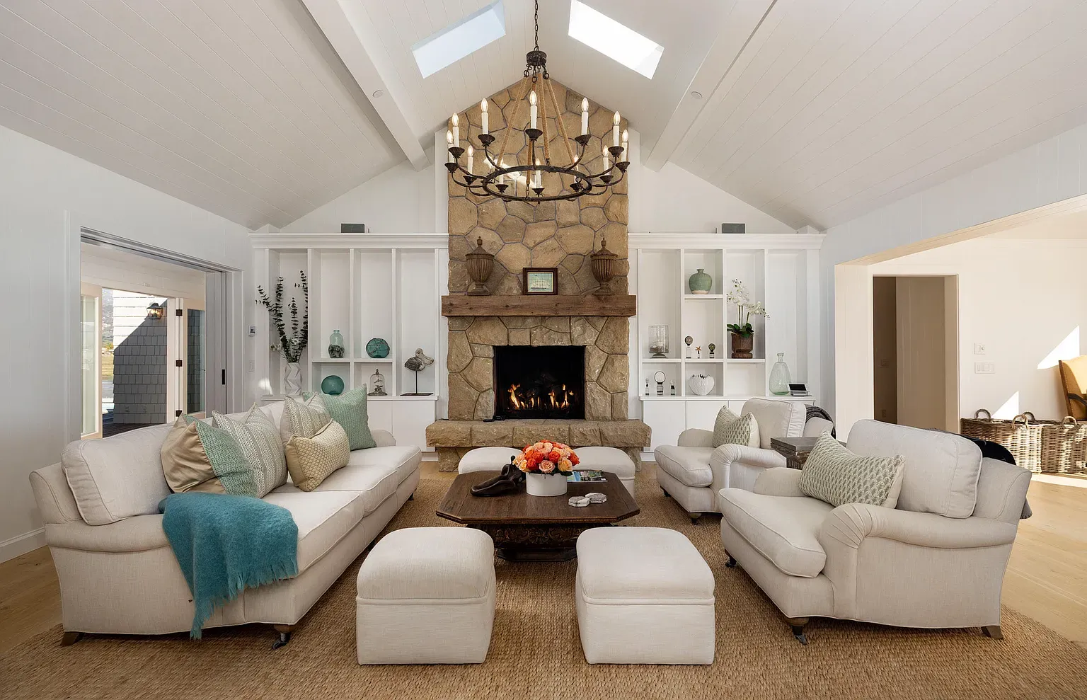 Vaulted beams plus skylights keep this room glowing. Big furniture actually fits comfortably.
