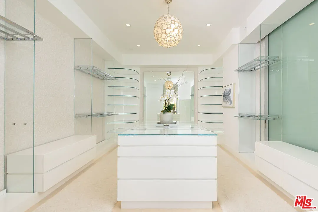 Wait, is this a boutique? All white walls and a huge glass display.