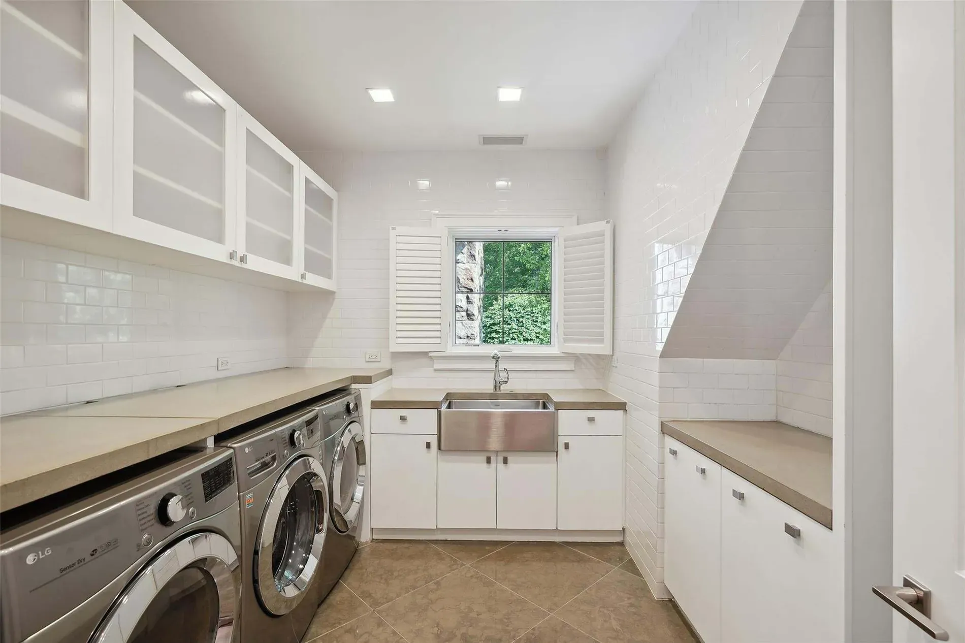 Laundry is brighter than my kitchen. Subway tiles, big sink, zero excuses now.