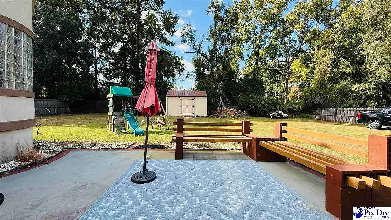 Back patio with a blue rug pulling the whole setup together.