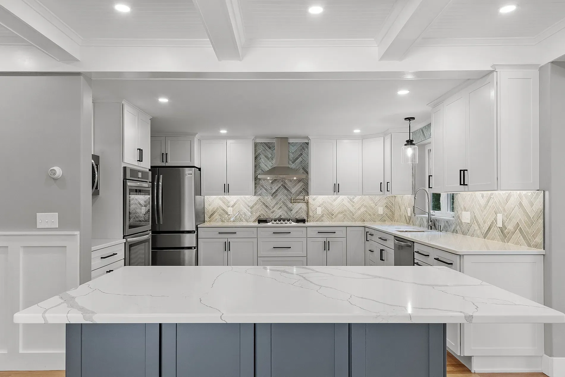 Soft white and gray kitchen, clean lines and a ton of light.