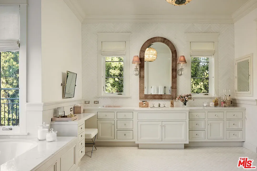 Spa bathroom vibes—creamy whites, wood accents, all very zen.