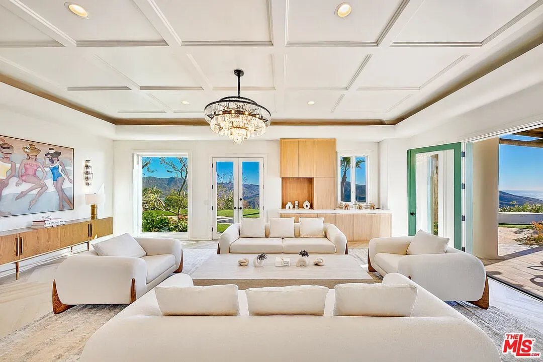 Minimalist lounge vibe. Coffered ceiling with recessed lights. Calm but a little bland?