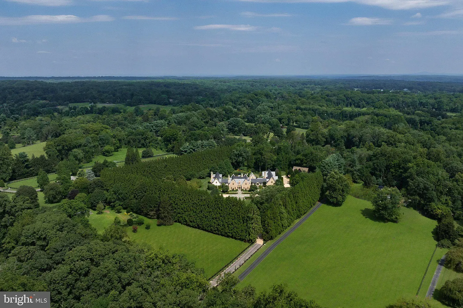 Aerial peek—hedges everywhere, super private. Lawn looks absurdly tidy.