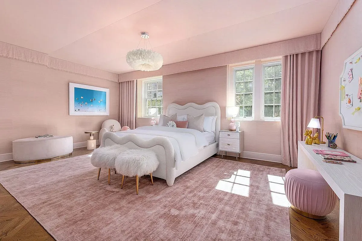 Pink-on-pink bedroom. Soft carpet, softer walls. Cloudy sleep energy.