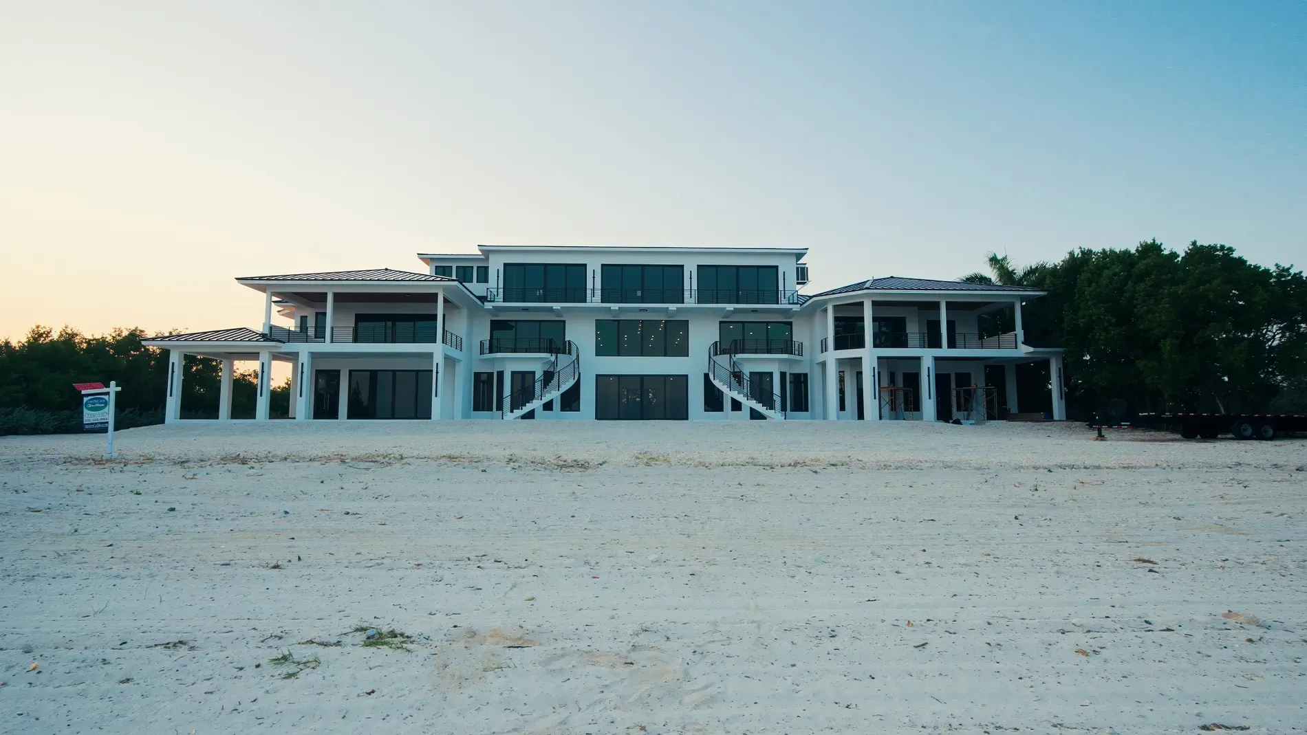 Glassy beach facade, super clean lines. I mean, beautiful, maybe a bit cold?