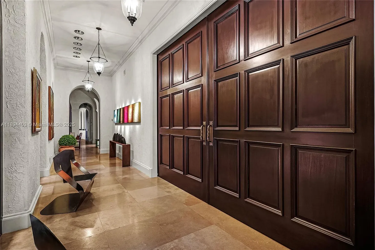 Entry flex. huge mahogany doors, glossy beige marble. Kinda hotel chic.