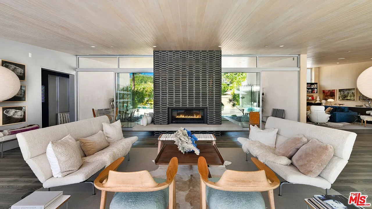 Pale wood ceiling steals it. Big sliders out to the patio, easy breezy.