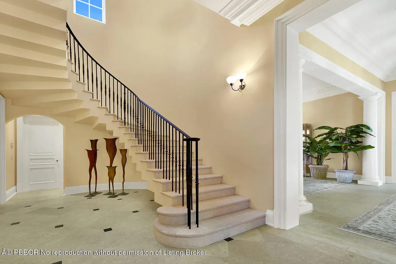 From this angle, the curved staircase steals it. Wrought iron looks expensive.