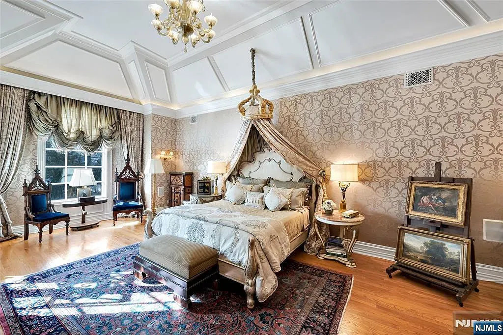 Coffered ceiling and glowing chandelier. Romantic, maybe a tad ornate.