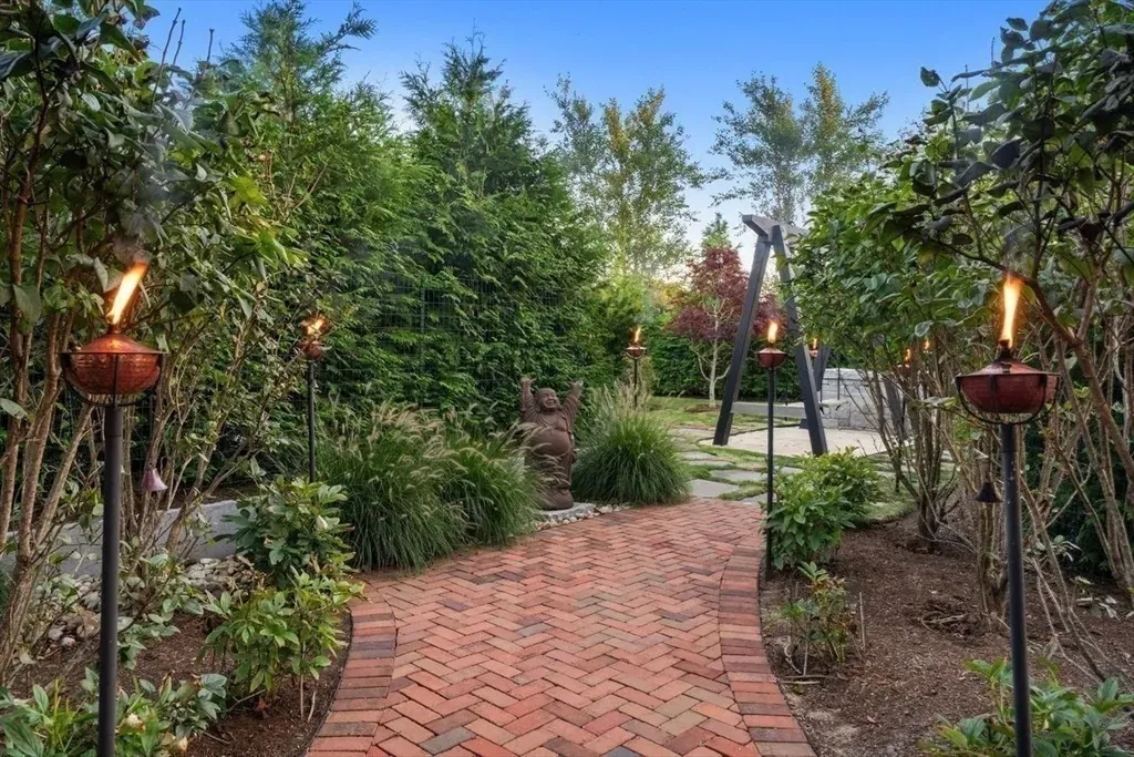 Brick path winding through shrubs. Feels a garden walk to nowhere.