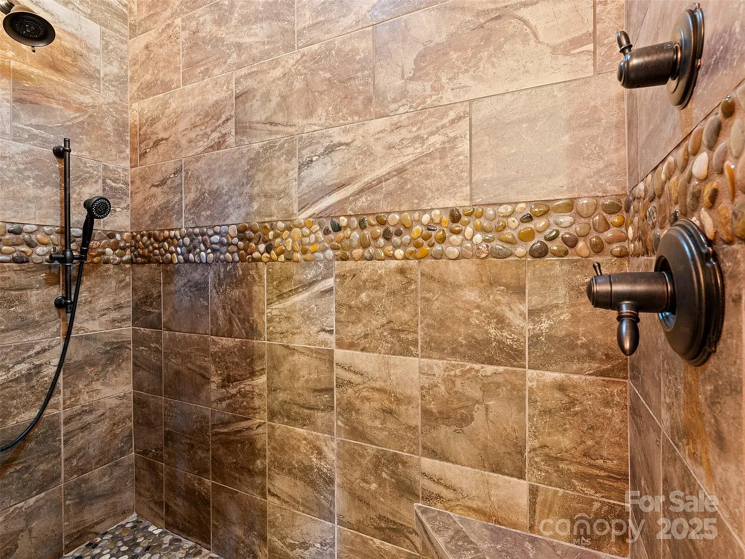 Pebble stripe in the shower is a small thing, big mood.