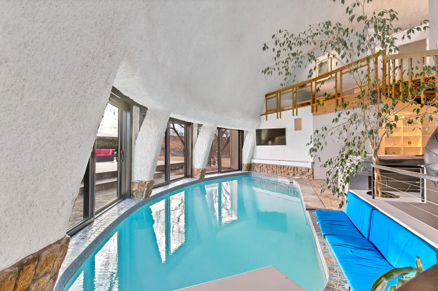 Those odd-shaped windows are cool, and the ceiling looks poured frosting.