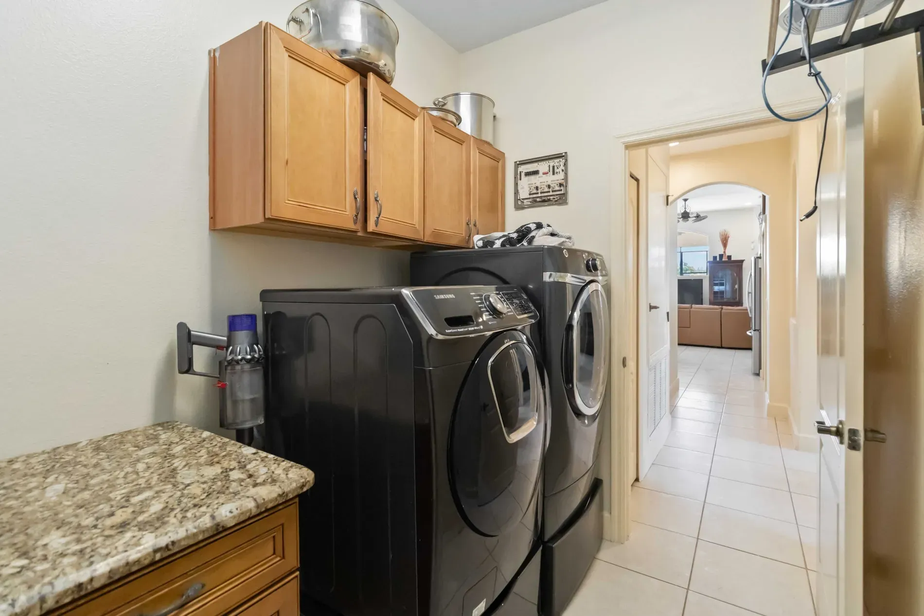 Laundry zone. sleek black front-loaders with warm storage above. Surprisingly nice.