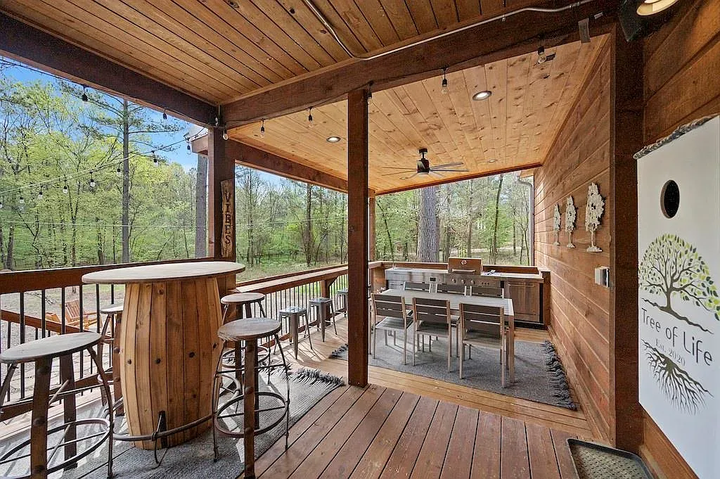 Big timber pavilion vibe, polished deck, exposed beams, plenty of hangout space.