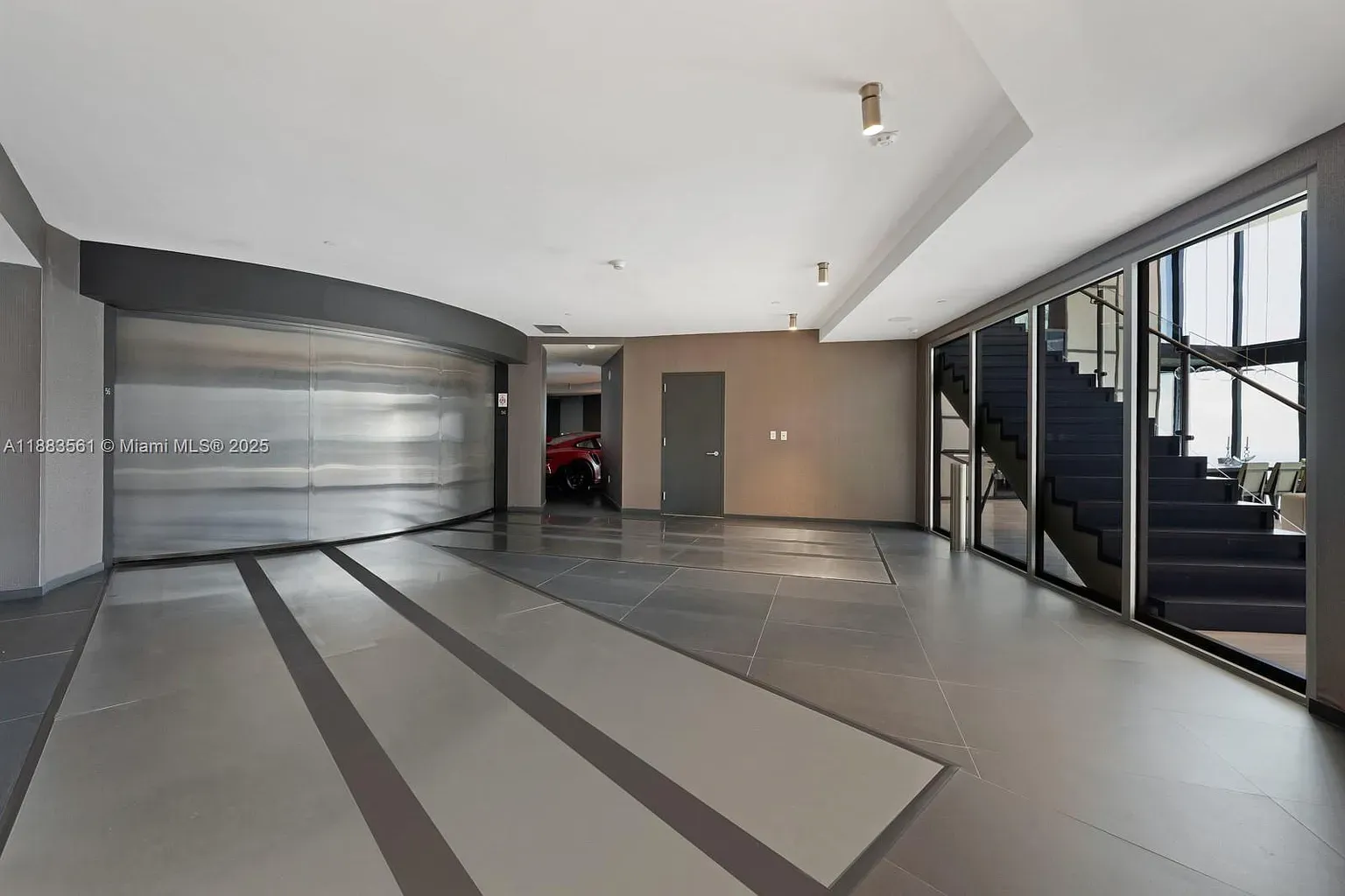 Another entry, big gray tiles doing geometry. Lots of glass, nice light.