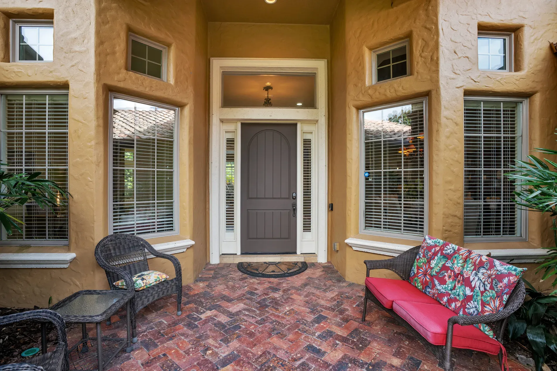 And the entry — golden stucco, chunky dark doors. Anyone else love big doors?
