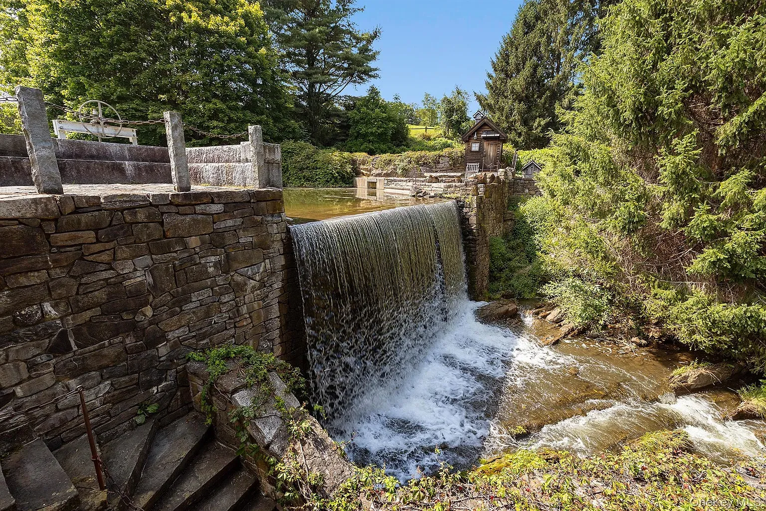 Okay, this water feature goes off. Gentle cascade, big stones, backyard white noise.