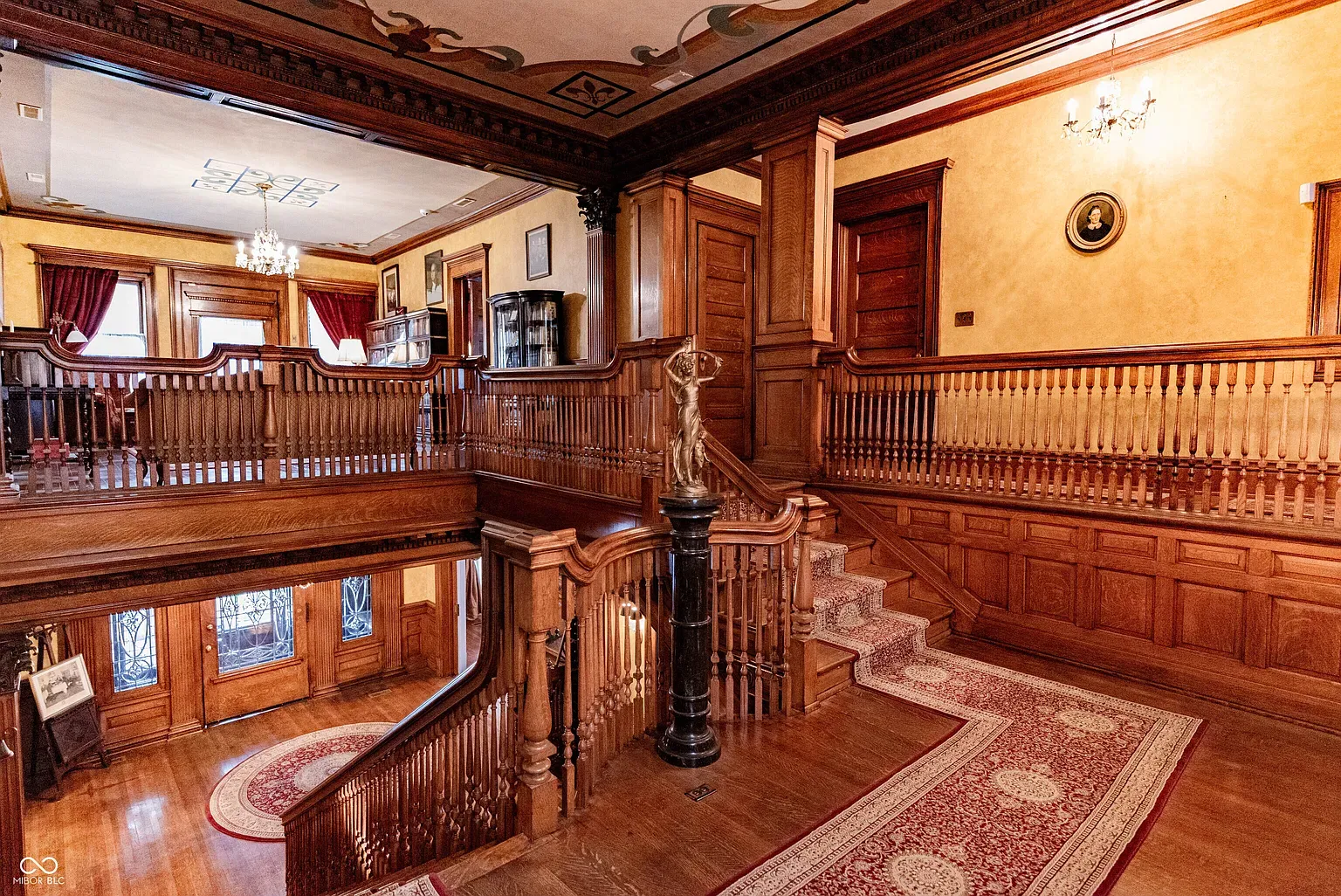 Second staircase shot because it deserves it. Ceiling details go wild above.