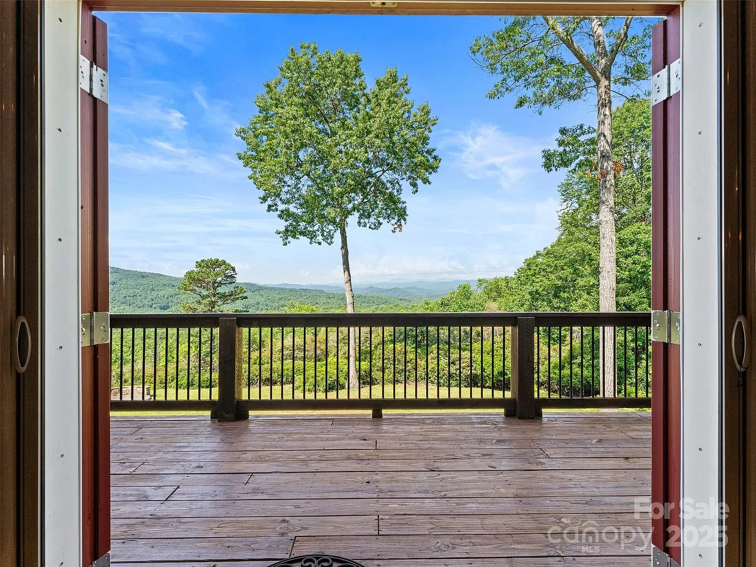 Those double doors opening to the deck are doing heavy lifting.