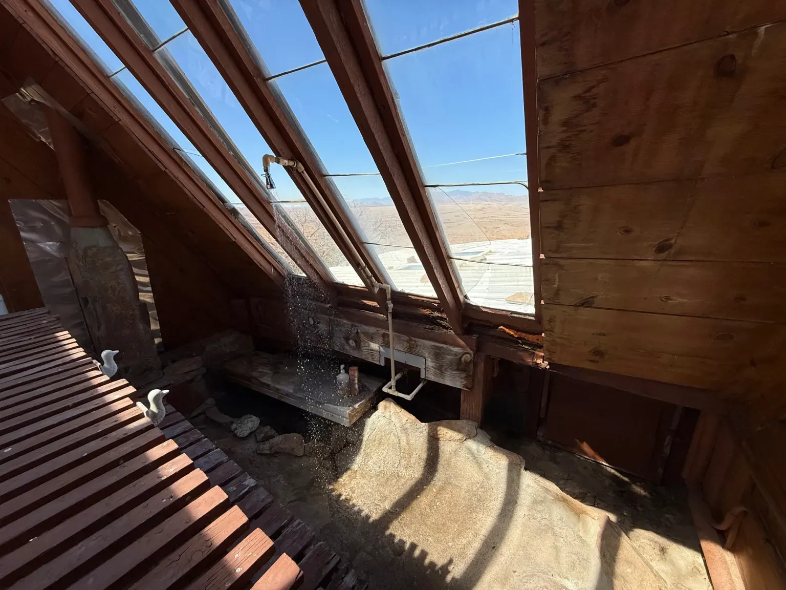 Attic loft is all wood angles and cozy, a vintage cabin.