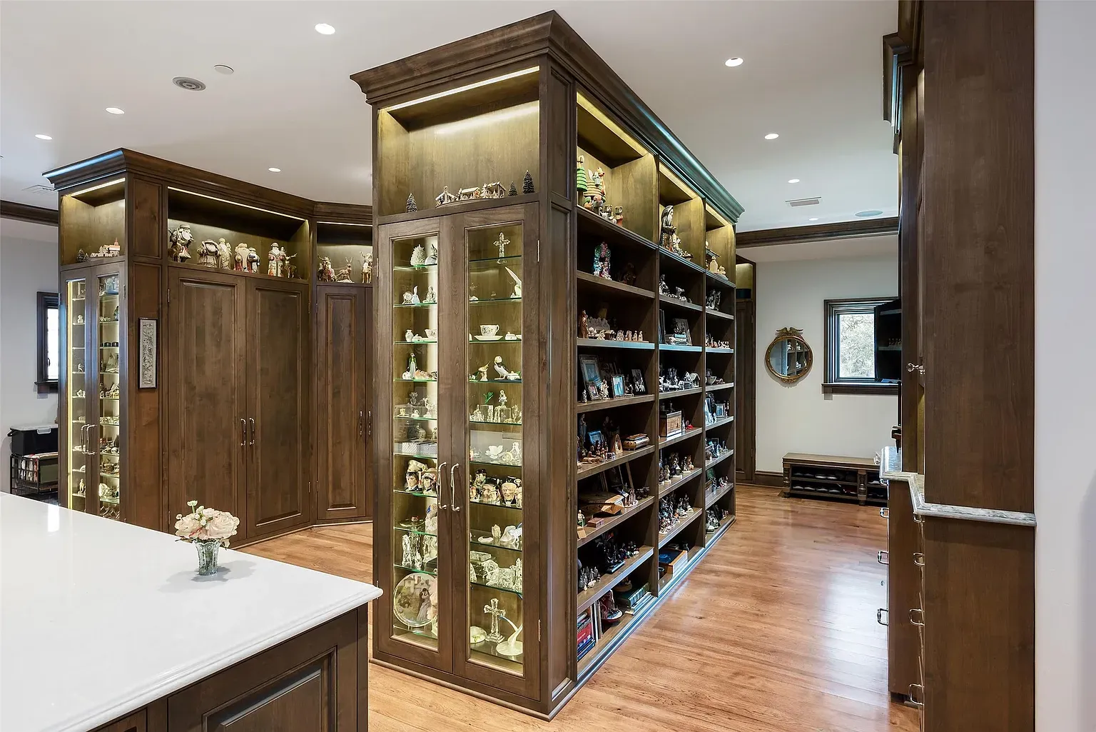 Built-ins for days. Tall display cabinets, rich wood, very curated.