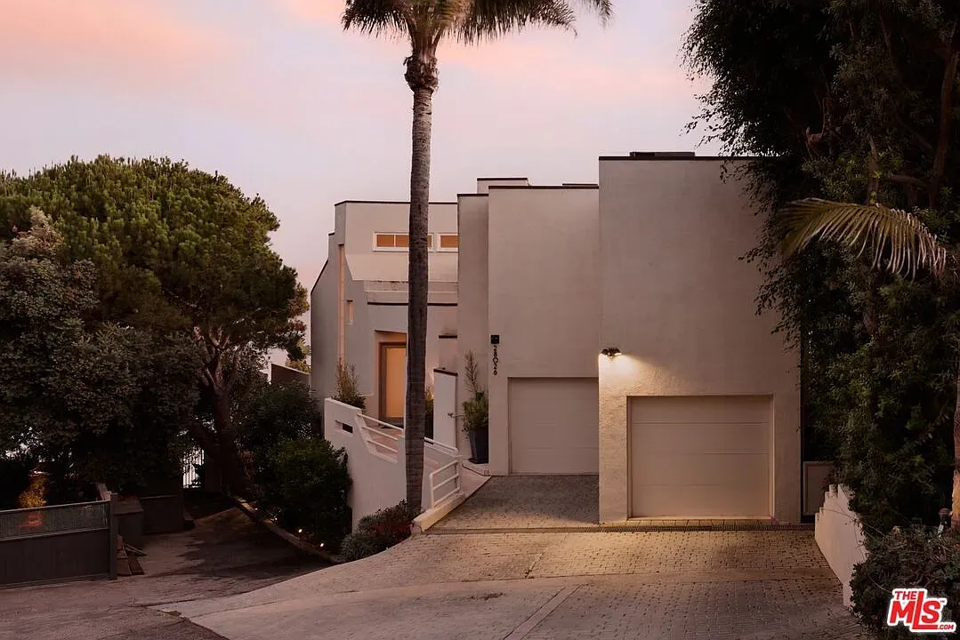 Facade goes full minimal—big rectangles punched out. Anyone know why no eaves?