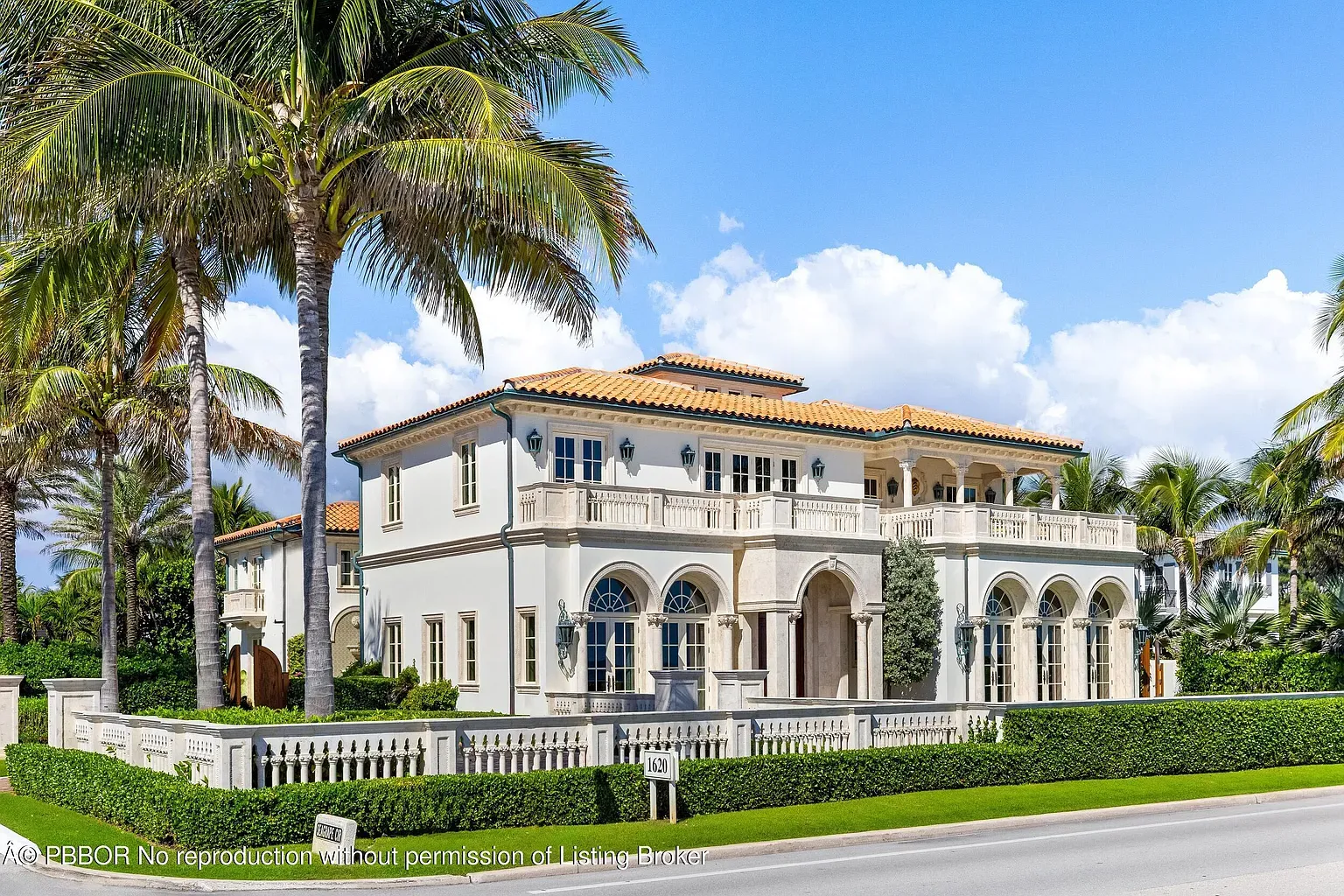 Another exterior—terracotta roof, palms everywhere. Classic Mediterranean flex.
