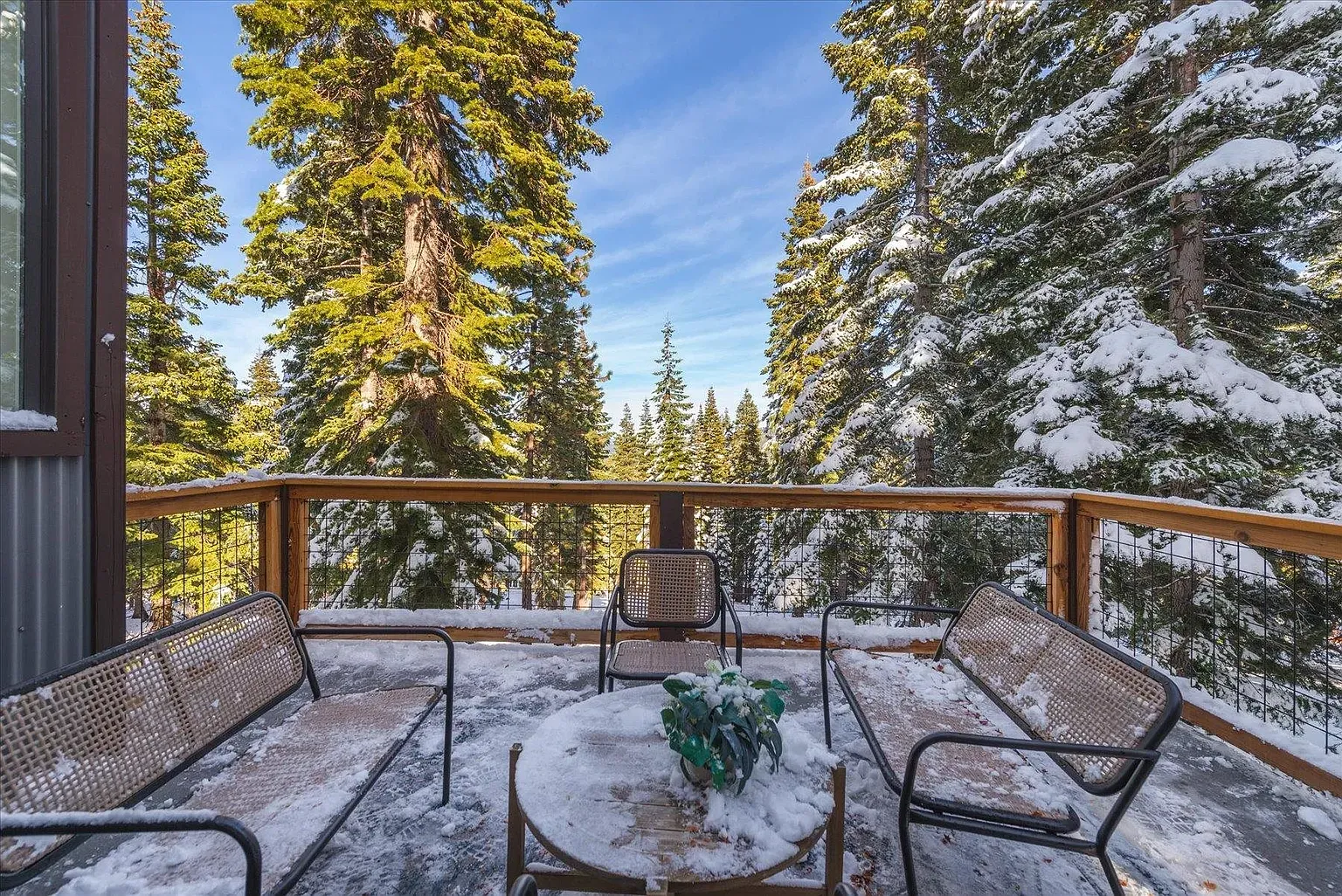 Balcony in the trees. Morning coffee, watching the snow fall.
